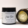Vanilla Tallow Whipped Balm jar with open lid showing cream inside, on a white background.